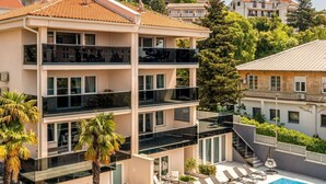 A multi-story hotel with balconies, a swimming pool, and surrounding greenery. - Moderne Wohnung in Crikvenica mit schöner Terrasse by Interhome (Crikvenica)