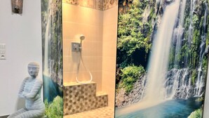 A bathroom with a mosaic floor, a shower, and a mural of a waterfall. - Elegante Ferienwohnung in Hollnich mit Garten by Interhome (Auw)