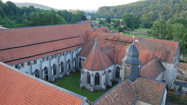 A historic building with a red-tiled roof, stone walls, and a central tower. - Fewo Stricker 23 by Interhome (Walkenried)