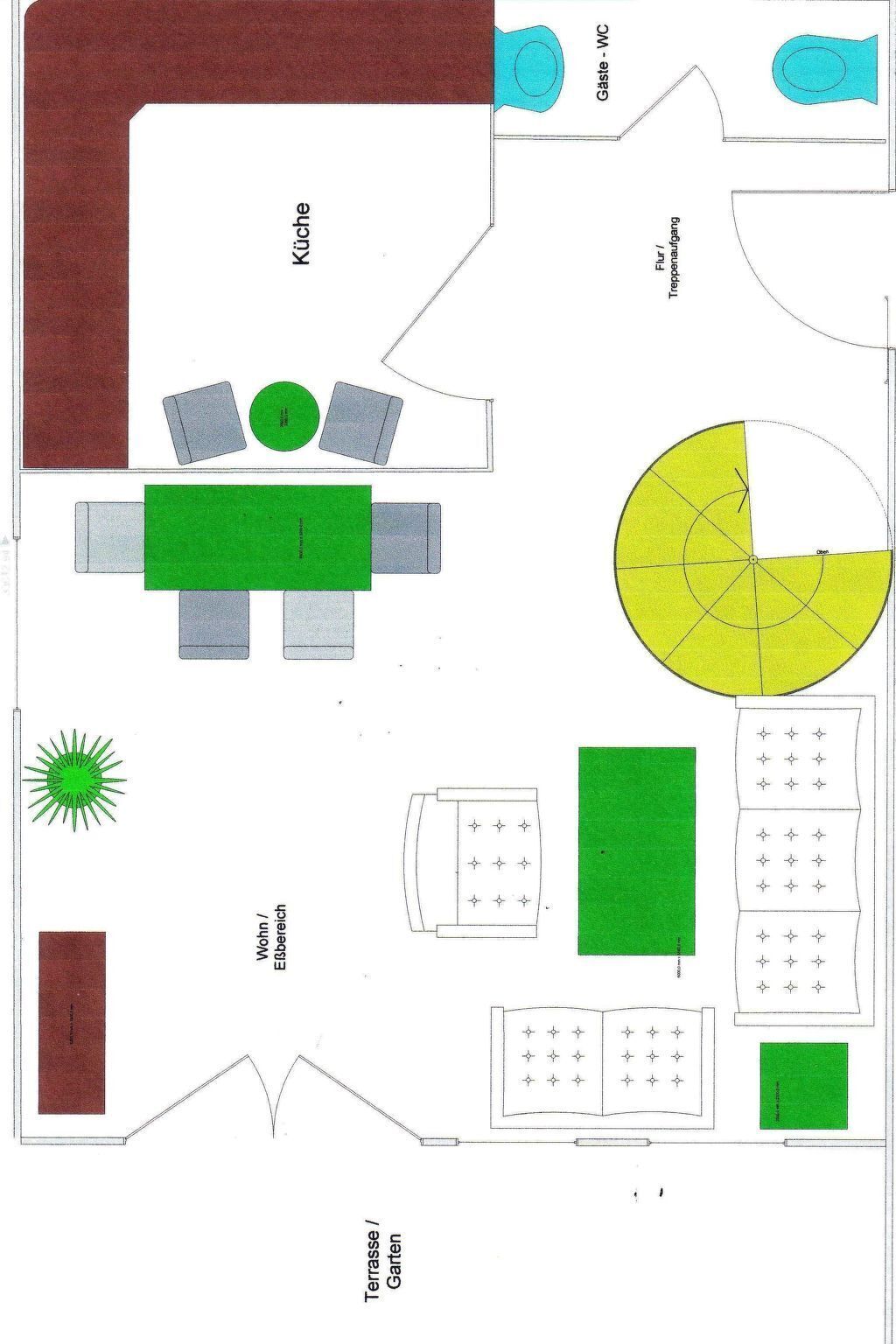Un plan d’étage comprenant une cuisine, un coin repas, un salon et un jardin.