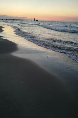 A beach with a pier extending into the water. - Strandnahe Fewo App. 1 by Interhome (Zinnowitz)