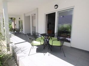 A covered patio with outdoor furniture and a view of the surrounding landscape. - Ville Corinthia 1 by Interhome (Krk/Baška)