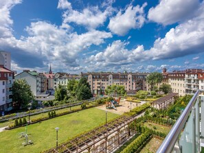 A residential area with apartment buildings, a playground, and a well-maintained garden. - Rose 1 in Swinemünde am Meer by Interhome (Swinoujscie)