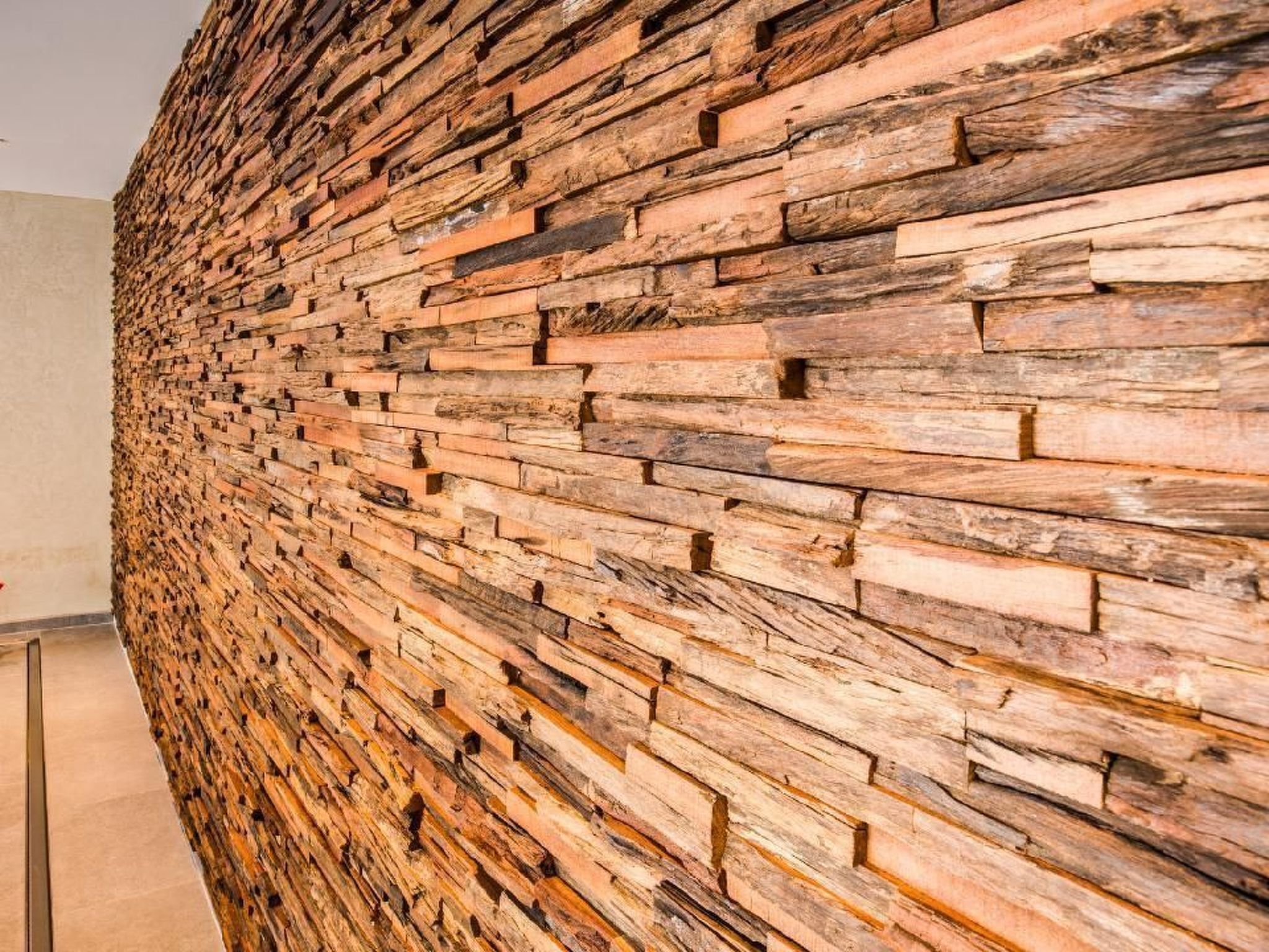 A textured wall with a layered brick pattern.