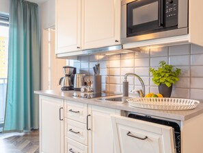 Fridge, microwave, dishwasher, cookware/dishes/utensils