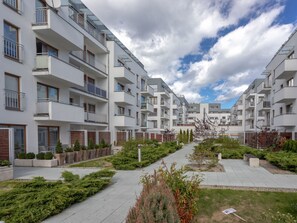 A modern apartment complex with multiple balconies, a central pathway, and landscaped areas. - Strandnahe Ferienwohnung Celeste by Interhome (Swinoujscie)