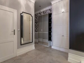 A hallway with white doors, a large mirror, and a closet with a patterned wallpaper. - Strandnahe Ferienwohnung Celeste by Interhome (Swinoujscie)