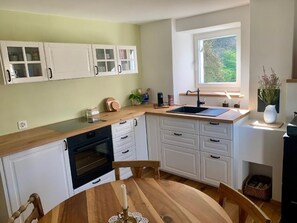Fridge, oven, cookware/dishes/utensils