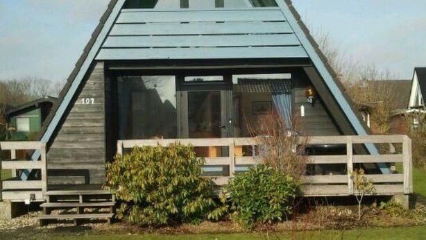 A triangular-shaped building with a prominent gable and a spherical object on top. - Tossi Haus 107 in Fedderwardersiel by Interhome (Burhave)