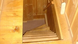 A wooden staircase leading to a lower level. - Ruchweid by Interhome (Ebnat-Kappel)