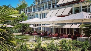 A modern hotel with outdoor dining areas, a pool, and a garden setting. - Parkresidenz Meilen by Interhome (Meilen)