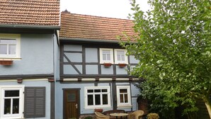 A traditional half-timbered house with a garden in front. - Fachwerkhaus mit Garten, Grill und Terrasse by Interhome (Behringen)