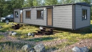 A mobile home with a single-level layout, a small porch, and a vehicle parked nearby. - Mobilheim Zweiundvierzig in Lychen by Interhome (Lychen)
