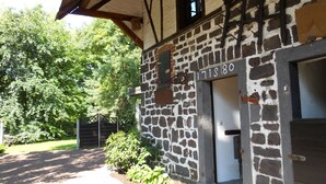 A stone building with a wooden roof and a door marked "1718 80". - Weyerhof by Interhome (Kobern-Gondorf)