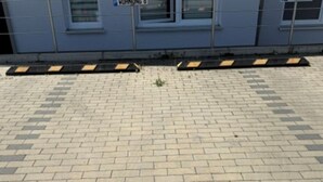 A paved walkway with a metal railing and a building with windows in the background. - Panorama 180° by Interhome (Kitzingen)