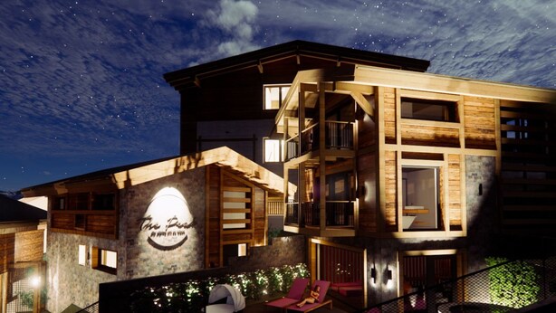 A modern hotel with a prominent sign, multiple balconies, and outdoor seating areas. - Chalet White Diamond by Interhome (Sölden)
