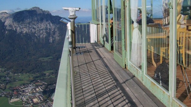 A balcony with a telescope, glass walls, and a view of a mountainous landscape. - in Sankt Koloman mit Bergblick by Interhome (St. Koloman)