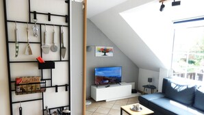 A modern living room with a TV, sofa, and coffee table. - Ostsee Perle by Interhome (Niendorf)