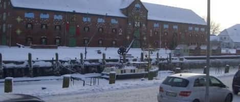 A building with a snow-covered roof and a number '24' on it.