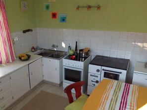 Fridge, oven, cookware/dishes/utensils