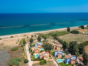 A coastal residential area with houses, a beach, and a clear view of the sea. - in Polis Chrysochous mit Offenem Kamin by Interhome (Polis Chrysochous)