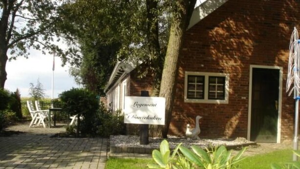 A brick building with a sign reading "Lagerhaus & Gasthof." - Unterbringung Ganzekuken by Interhome (Vriescheloo)