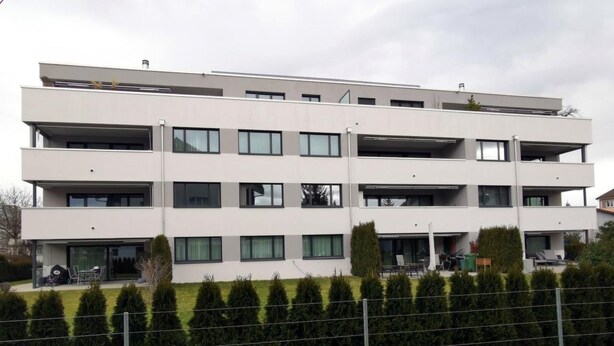 A multi-story building with balconies and large windows. - HIRSCHEN by Interhome (Gossau SG)