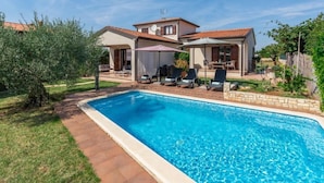 A two-story house with a swimming pool, outdoor seating, and a garden. - Villa Lucas by Interhome (Novigrad (Istra))
