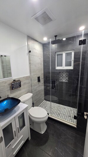 Shower, hair dryer, towels, soap