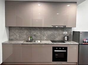 Standard Apartment | Private kitchen | Fridge, stovetop, cookware/dishes/utensils - Sunny Residence (Ha Noi)