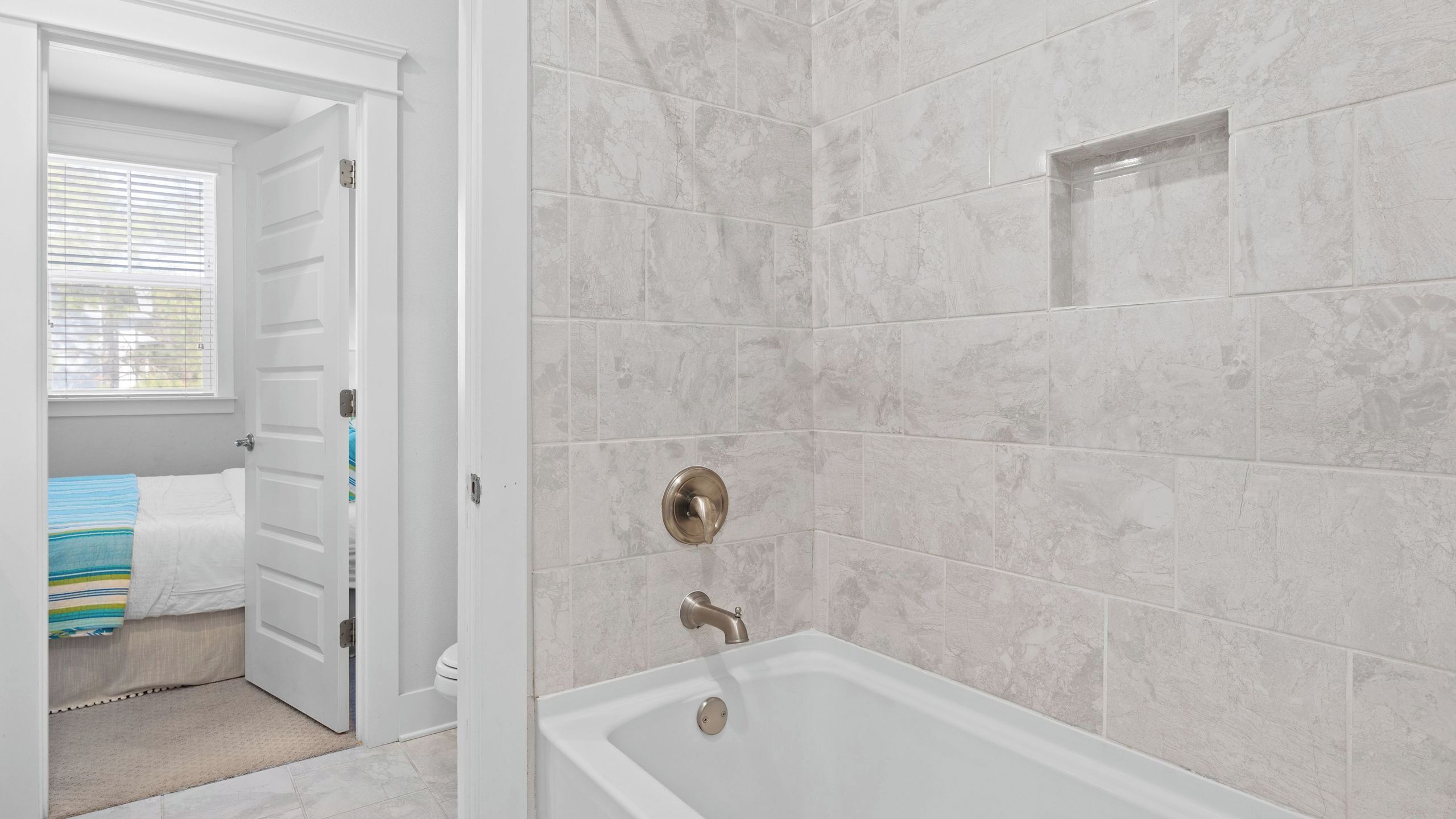 A bathroom with a bathtub, a shower, and a toilet.