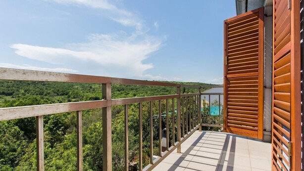 A balcony with a view of a forested landscape. - Ceković 2 by Interhome (Krk/Šilo)
