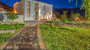 A modern building with a paved entrance, a small tree, and a well-maintained garden. - in Dugopolje mit Privatem Pool by Interhome (Dugopolje)