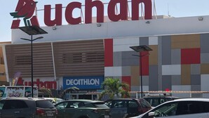 A shopping center with a large 'uchan' sign, a 'Decathlon' store, and several parked cars. - Sweet Urban Teranga: Very well located apartment. Near the corniche, the center (Dakar)