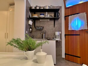 Fridge, microwave, cookware/dishes/utensils