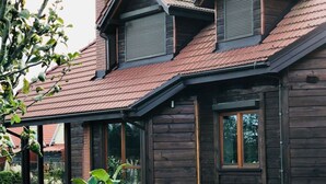 A modern wooden house with a sloped roof and large windows. - Haus am Meer by Interhome (Krokowa)