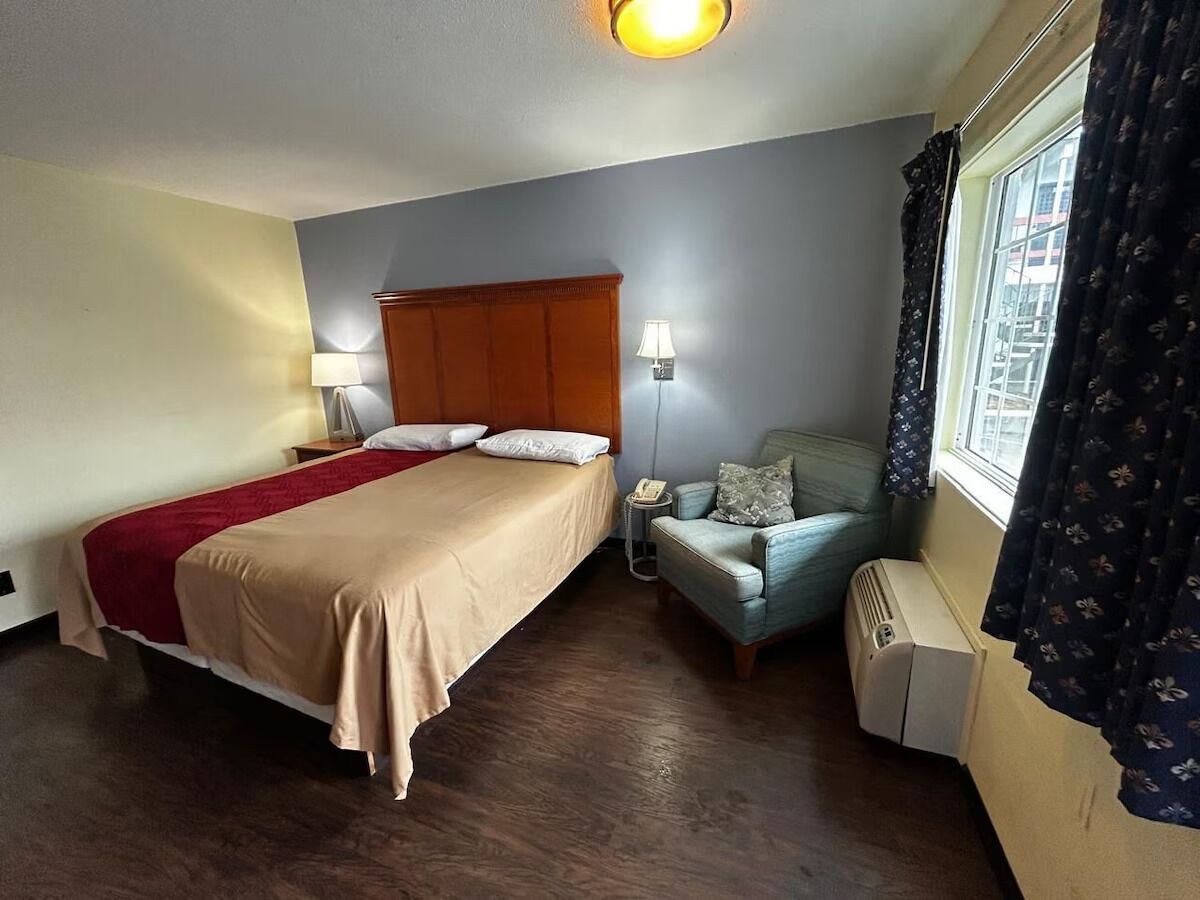 Unwind in a bright, spacious room with cozy seating.
