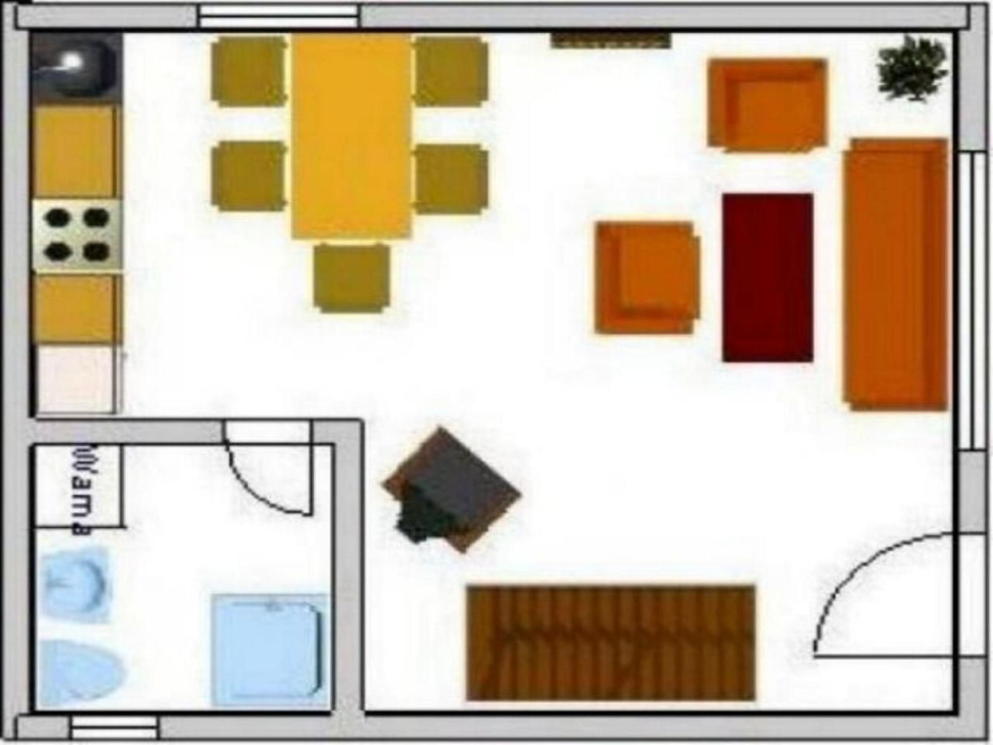 Een keuken met een eethoek, een kleine badkamer en een zithoek met een bank en stoelen.