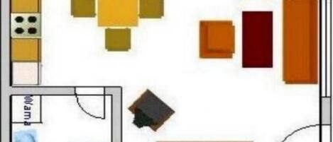 Een keuken met een eethoek, een kleine badkamer en een zithoek met een bank en stoelen.