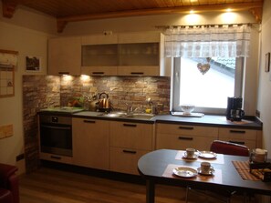 Fridge, oven, cookware/dishes/utensils - Ruhiges Landhaus mit zwei gemütlichen Wohnungen by Interhome (Bereborn)