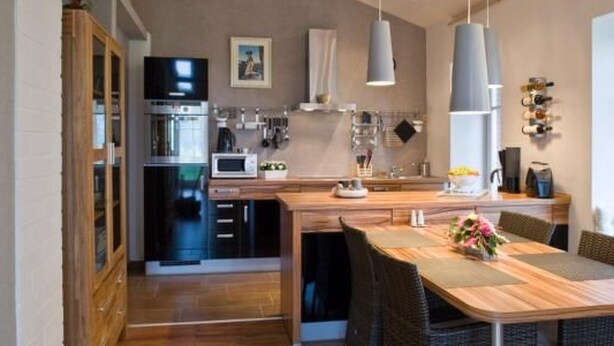 A modern kitchen with a central island, built-in appliances, and pendant lighting. - Apartment Abendsonne mit eigener Terrasse by Interhome (Klein Meckelsen)