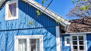 A blue building with a white window and a door. - Villa Bullerbü by Interhome (Norrhult)