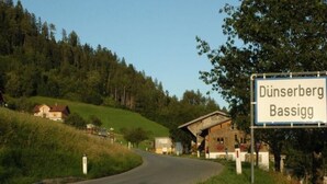 A rural road with a sign for Dünsberg Bassigg. - Dünser in Dünserberg by Interhome (Dünserberg)