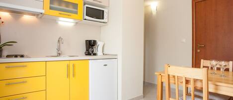 Fridge, microwave, cookware/dishes/utensils