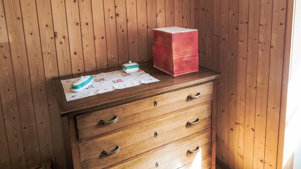 A wooden dresser with drawers and a box on top. - Waterfall House by Interhome (Mesocco)