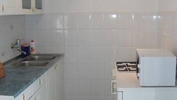 Fridge, microwave, cookware/dishes/utensils