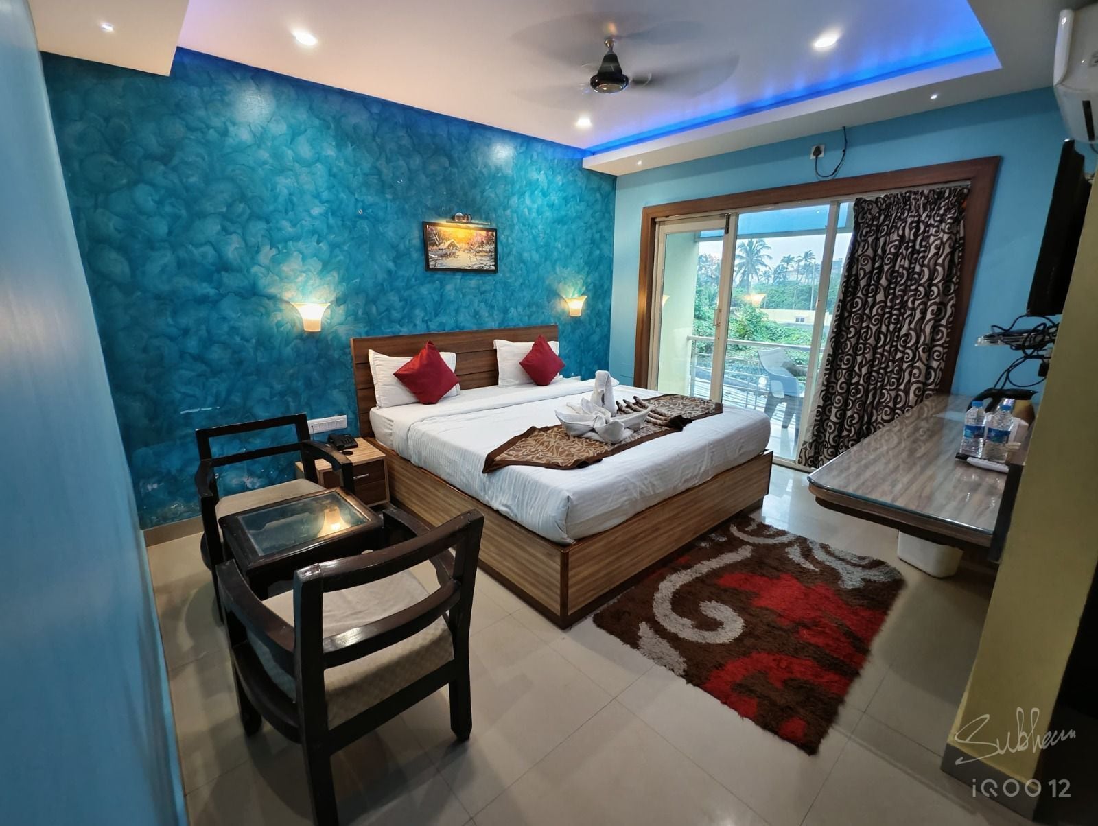 Premium bedding, desk, laptop workspace, soundproofing