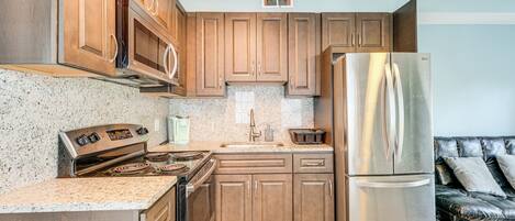 Fridge, stovetop, coffee/tea maker, cookware/dishes/utensils