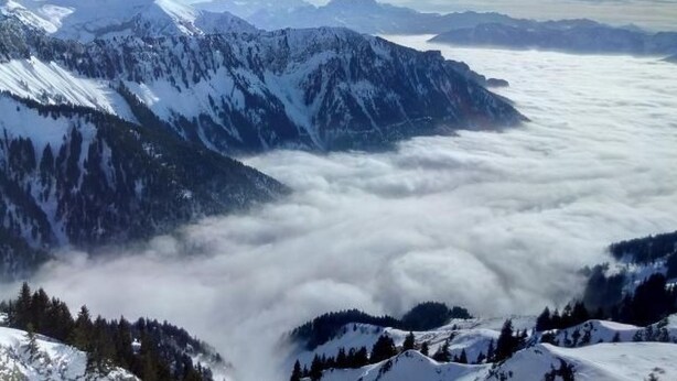 A mountain landscape with snow-covered peaks and a valley of clouds. - Gais Alpins by Interhome (Montreux)