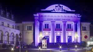 The exterior of the König Albert Theater with illuminated signage and a classical architectural style. - Appartement mit Bergblick by Interhome (Bad Elster)
